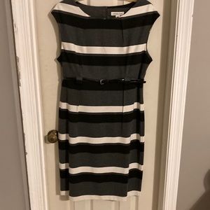Gray, black and white dress with black belt